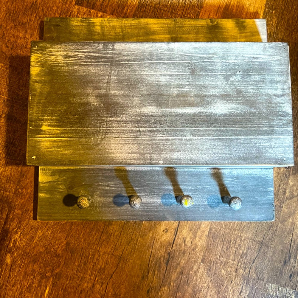 Wooden key hanger with storage in top.